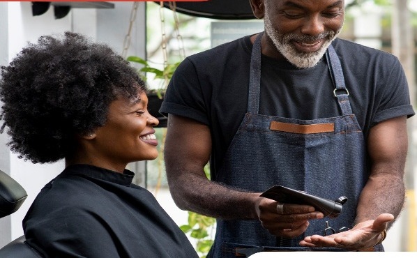 A beauty business owner getting their shop set up on Podium